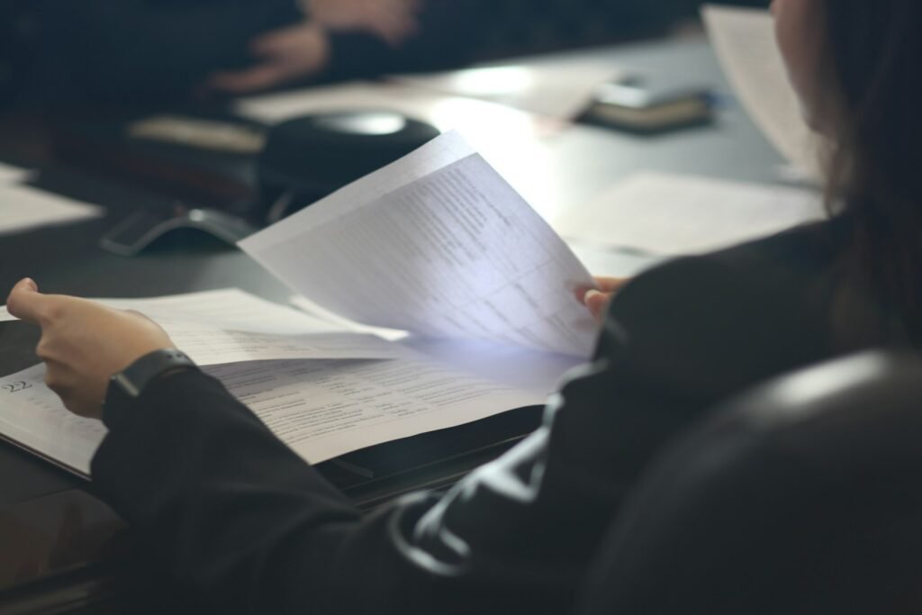Business leader reading a printed executive summary at a table