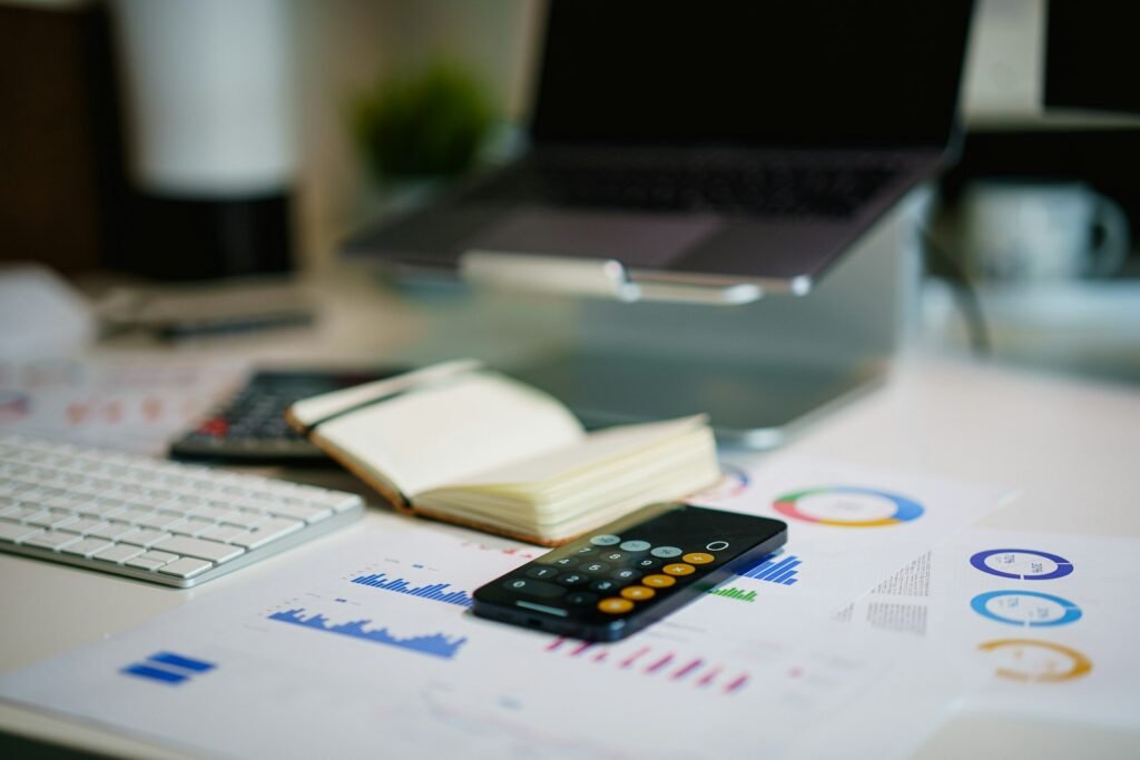 Financial report with charts and a calculator for pitch deck projections