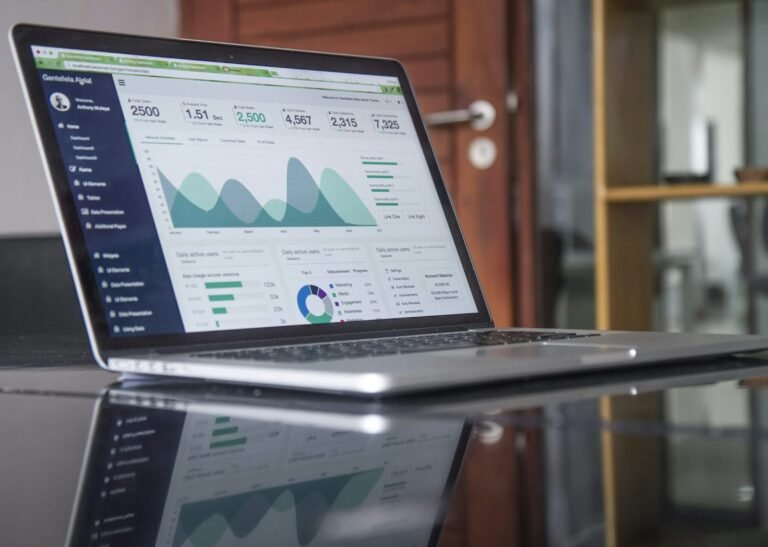 Laptop showing growth charts and traction metrics
